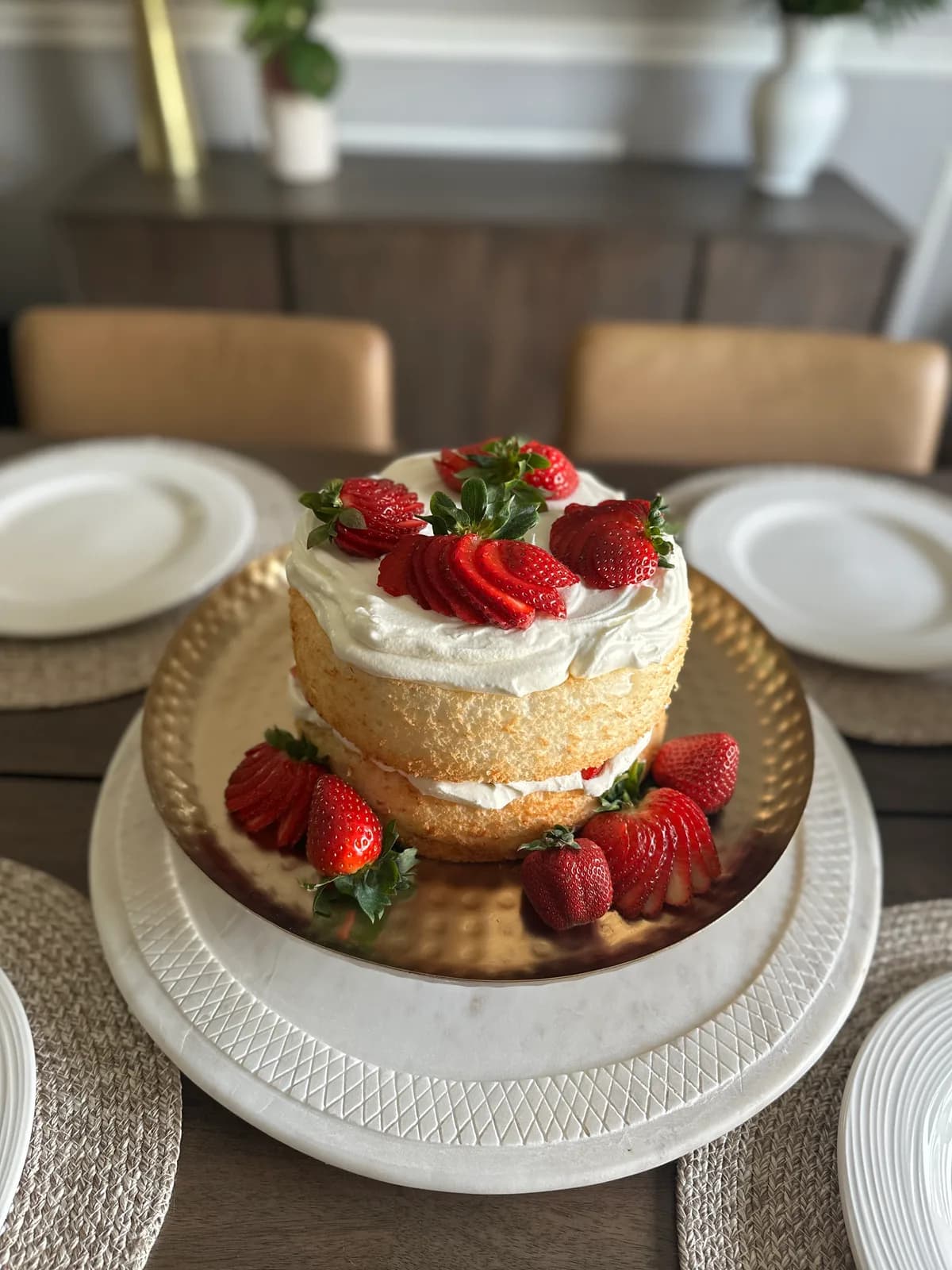 Strawberry shortcake from above with whipped cream and fresh berries