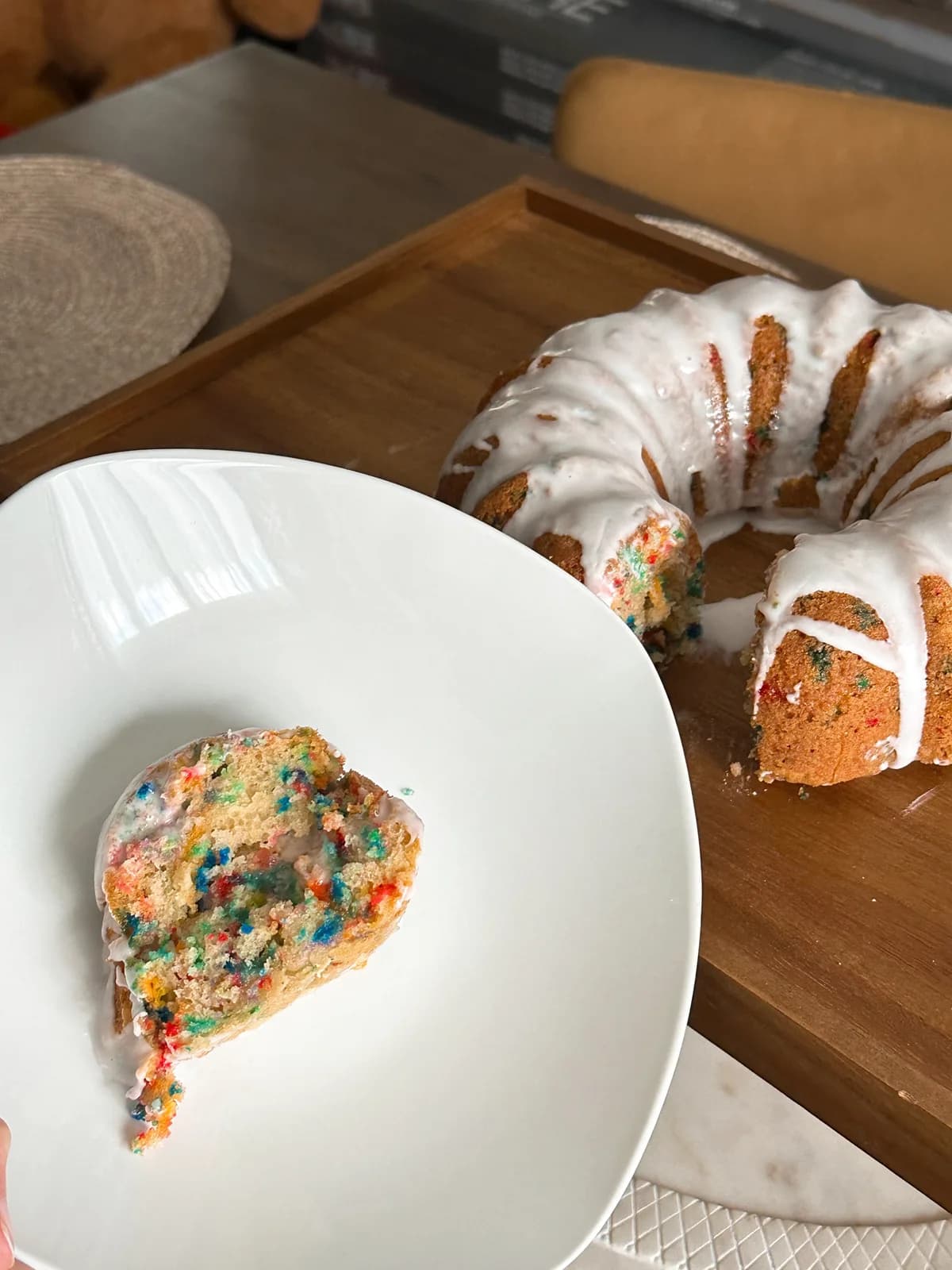 A funfetti bundt cake dusted with confectioners sugar