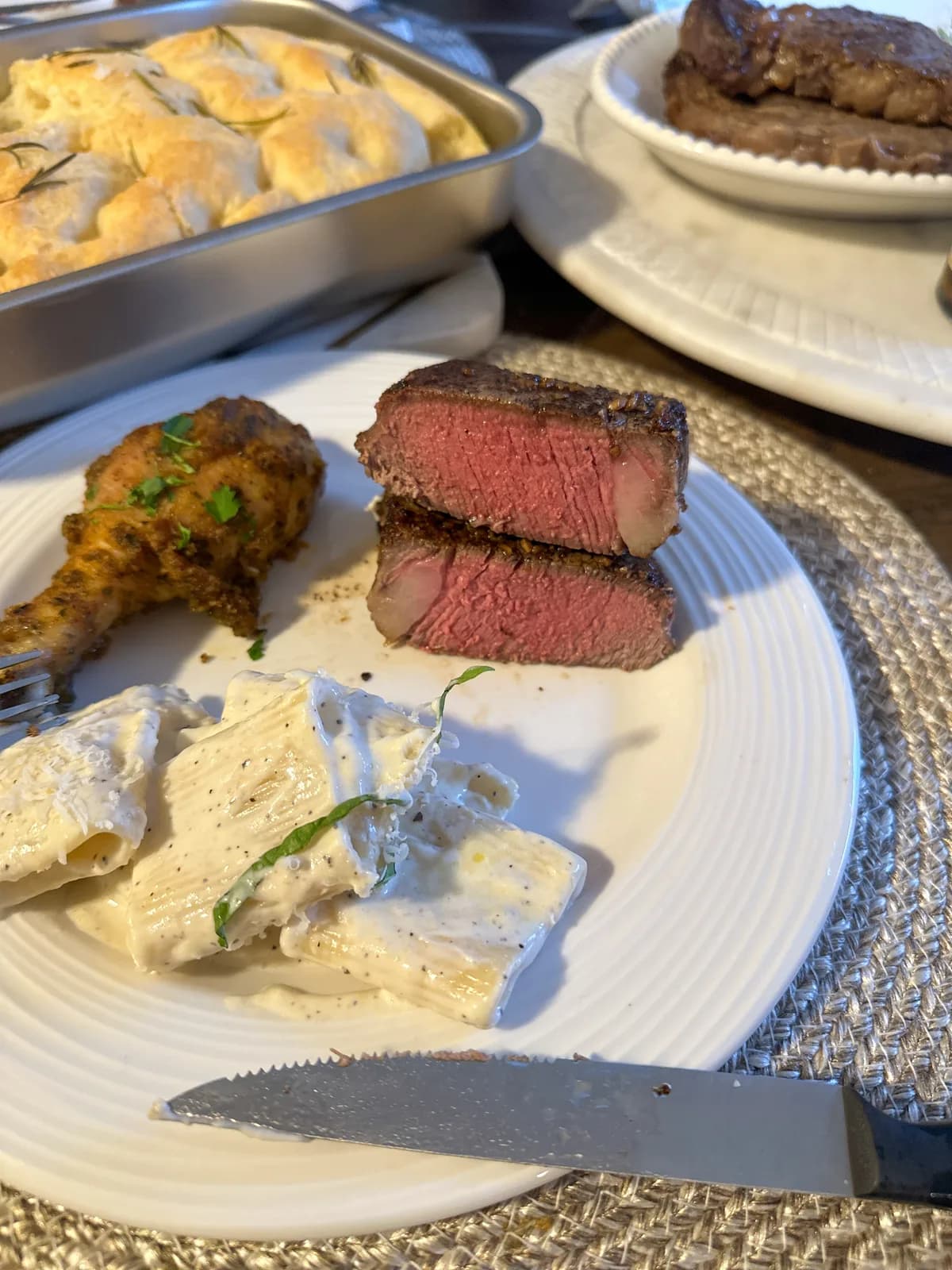 A perfectly cooked filet sliced in half showing a rosy medium center