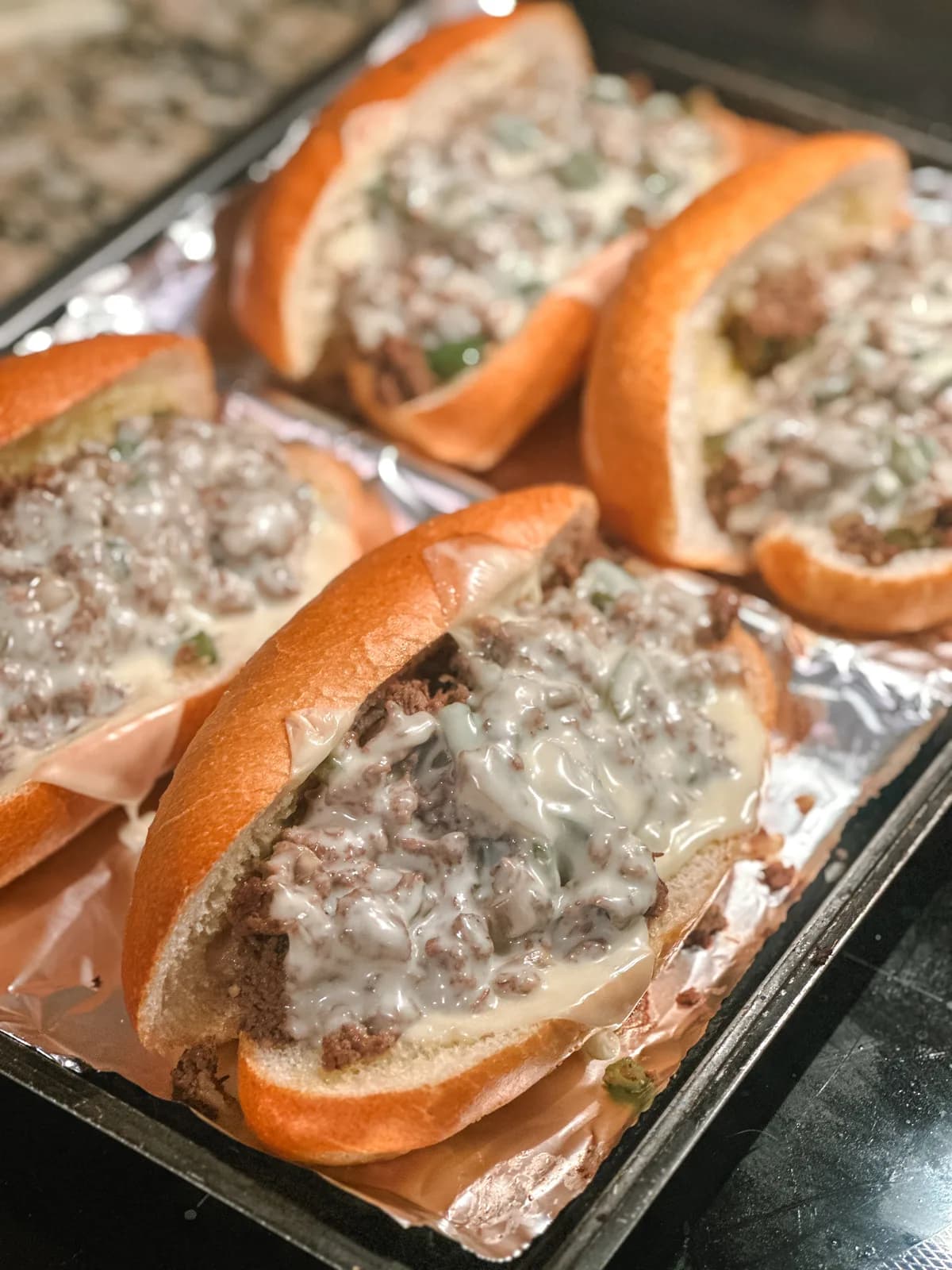 Philly cheesesteak sliders with melted cheese and onions