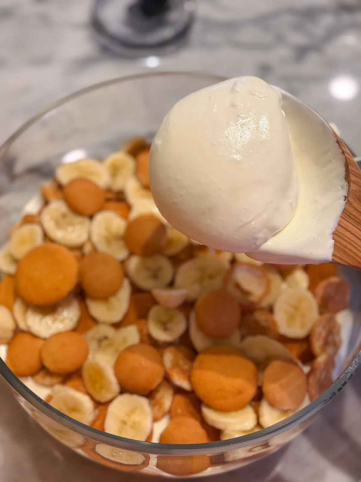 Layers of vanilla wafers and pudding before being combined into banana pudding